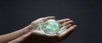 Hands holding glowing green energy sphere with magical light effects on dark background for fantasy and supernatural concepts.