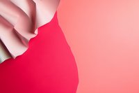 Elegant curved paper waves creating dynamic shadows on bright pink background, abstract minimalist composition with soft flowing forms and clean lines.