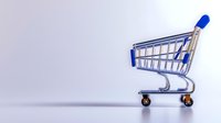 Empty shopping cart with blue handle on light background casting long shadow, minimalist composition for retail and commerce concepts.