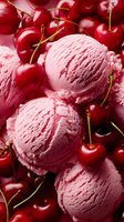 Pink cherry ice cream scoops surrounded by fresh ripe cherries, creating a vibrant summer dessert contrast for food photography and menu design.