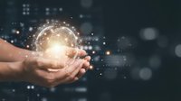 Hands holding glowing globe with digital network connections and data streams, representing global technology, innovation, and worldwide business communication solutions.