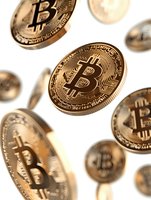Golden cryptocurrency coins falling on white background, macro shot with selective focus showing detailed metal texture and circuit pattern design.