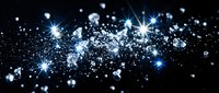 Glowing blue and white particles with sparkling light effects floating across dark background, suitable for festive, technology, and abstract design projects.