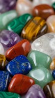 Collection of polished gemstones and crystals including amethyst, malachite, tiger eye, aventurine and jasper for healing, meditation and jewelry making.