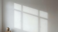Sunlight streaming through window panes casts geometric shadows on neutral wall, creating minimalist interior ambiance suitable for design backgrounds and architectural visualization.