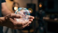 Elderly hands holding glowing crystal ball with magical light effects against dark background. Fortune telling, mysticism, prediction concept for spiritual content.