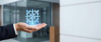 Businessman hand presenting glowing compass hologram in modern office environment for navigation and direction business concepts.