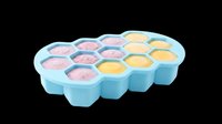 Silicone honeycomb ice cube tray with colorful frozen portions, isolated on transparent background, ready for kitchen, food, and print on demand design use.