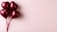 Burgundy heart shaped balloons bunch floating against light pink background. Romantic holiday celebration concept with copy space for text. Minimalist love design.