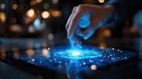 Futuristic digital interface with glowing blue hologram particles and human finger interaction on dark background with bokeh lights and magical effects.