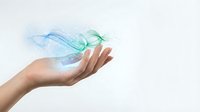 Young woman's hand holding flowing digital wave of blue and green light particles on white background, representing technology, innovation, and data transfer.