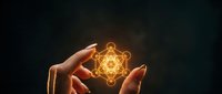 Hands protecting glowing sacred geometry symbol with golden light effects on dark background for spiritual and mystical design projects.