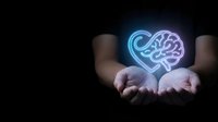 Glowing neon brain hologram floating above open cupped hands against dark background. Mental health, psychology, neuroscience and artificial intelligence concept.