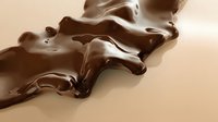 Liquid chocolate splash creating smooth waves and ripples on beige background, glossy melted dark chocolate flow with rich texture and reflective surface.