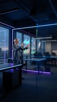 Middle-aged male professional in business suit analyzing holographic data visualizations and financial charts in modern office with neon lighting and city skyline view.