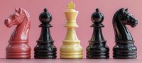 Classic chess pieces in pink, black and cream colors arranged in row showing knights, bishops and king on pink background. Strategic board game elements.