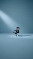 Modern black executive office chair with chrome base positioned in minimalist blue studio setting with dramatic directional lighting, suitable for corporate, business, and workplace design projects.