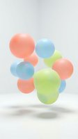 Colorful translucent spheres floating in soft pastel arrangement on white background for modern design projects and creative presentations.