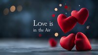 Red plush hearts floating with bokeh lights and romantic text on dark blue background, creating dreamy Valentine's Day atmosphere for greeting cards and social media.