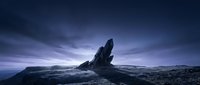 Dramatic rocky formation jutting from barren landscape under moody twilight sky with purple and blue tones, suitable for sci-fi, fantasy, and environmental design projects.
