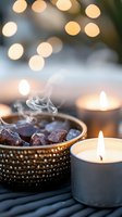 Aromatic frankincense resin burning in ornate metal bowl with glowing candles creating warm ambient lighting for meditation and relaxation rituals.