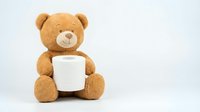 Cute brown teddy bear holding white mug isolated on white background for children products, gifts, toys, comfort items and nursery decor designs.