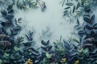 Moody botanical composition with dark blue eucalyptus leaves, delicate wildflowers and green foliage creating mystical garden atmosphere against foggy background.