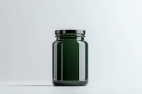 Empty dark green glass jar on white background, minimalist composition for packaging mockup and product presentation, isolated container for food storage.