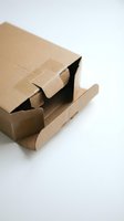 Open brown cardboard shipping box with flaps unfolded on white background, ready for packaging and delivery services.