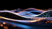 Abstract glowing waves with sparkles and bokeh effects in blue and gold colors against dark background create magical flowing light pattern.