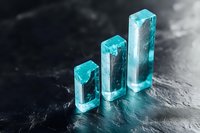 Glowing turquoise crystal bars arranged in ascending order on dark textured surface create modern minimalist composition with dramatic lighting effects.