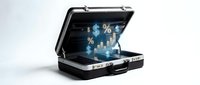 Open black briefcase displaying holographic financial data charts graphs and statistics floating above laptop computer for business analytics presentation.