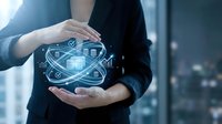 Professional businesswoman protecting digital technology innovation with holographic data visualization and cybersecurity symbols in modern office environment.