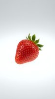 Fresh red strawberry with green leaves isolated on white background, ready for food packaging, recipe blogs, and culinary design projects.