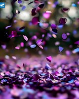 Falling purple and blue confetti pieces captured in motion against blurred background, creating magical celebratory atmosphere with scattered metallic fragments on surface.
