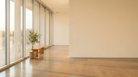 Modern minimalist interior with floor-to-ceiling windows, warm wooden floors, and natural light creating serene architectural space for contemporary design.