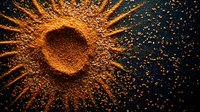 Glowing golden powder explosion in sunburst pattern against dark background, with scattered particles creating dramatic radial effect. For cosmetic and artistic designs.