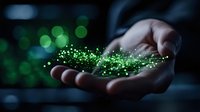 Magical green sparkles and glowing particles floating above open palm in dark environment with bokeh lights, representing hope, spirituality and supernatural power.