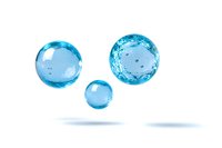 Floating blue water spheres with transparent liquid drops isolated on white background, showing surface tension and refraction effects in clean pure water.
