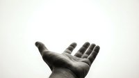 Open hand reaching upward in black and white, symbolizing hope, help, prayer, or spiritual connection against clean background for versatile design use.