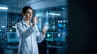 Female doctor in white coat interacting with holographic medical data display in modern hospital laboratory for healthcare technology applications.