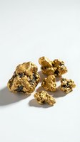 Raw gold nuggets collection isolated on white background for mining industry and precious metals investment concepts.