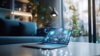 Laptop displaying glowing holographic data visualization on desk with blue sofa and plants in modern office interior, futuristic technology concept.