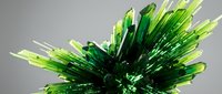 Abstract green crystal formation with sharp geometric spikes radiating outward on neutral background for modern design projects.
