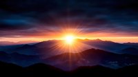 Stunning mountain sunrise with dramatic sunburst rays illuminating layered peaks and valleys in golden orange and purple hues for nature photography.