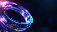 Glowing circular light trail with sparkling particles in blue and purple colors against dark background creates magical atmospheric effect.