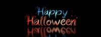 Glowing neon Happy Halloween text with reflection on dark background, spooky festive lettering in blue and red colors creates mysterious atmosphere.