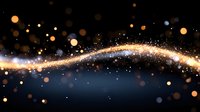 Magical glowing golden light trail with sparkles and bokeh effects on dark blue background, abstract festive design element for celebrations and holidays.