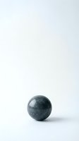 Dark green marble sphere on white background with soft shadow for minimalist design projects and wellness concepts.