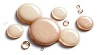 Beige liquid foundation drops and bubbles on white background, cosmetic texture for makeup artists and beauty professionals.